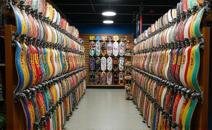 Shelves stocked with skateboard decks.